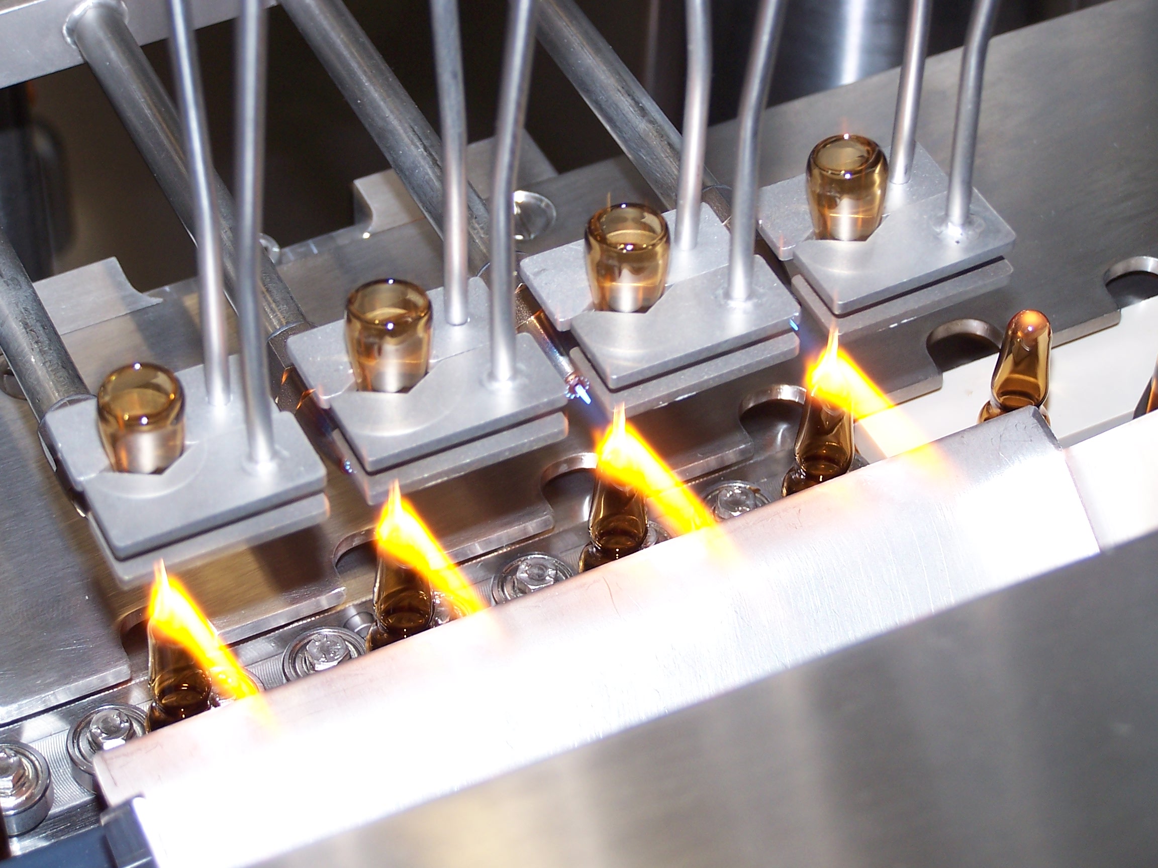 Ampoule filling and sealing machines