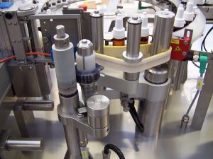 Labelling machines for ampoules and vials